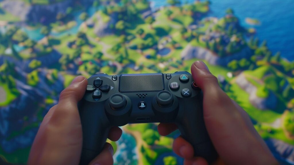 Player's hands expertly using a controller in an intense Fortnite game