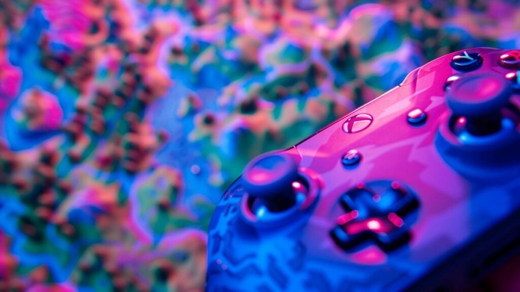 Closeup of a colorful gaming controller used in battle royale games.